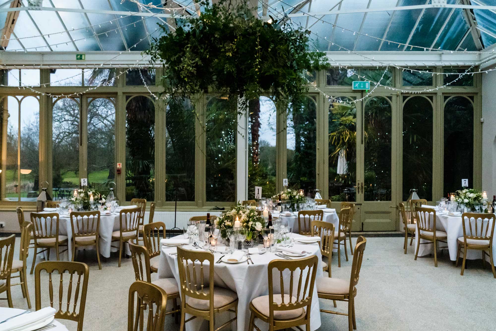 Decorated tables in the Hampton Court House conservatory
