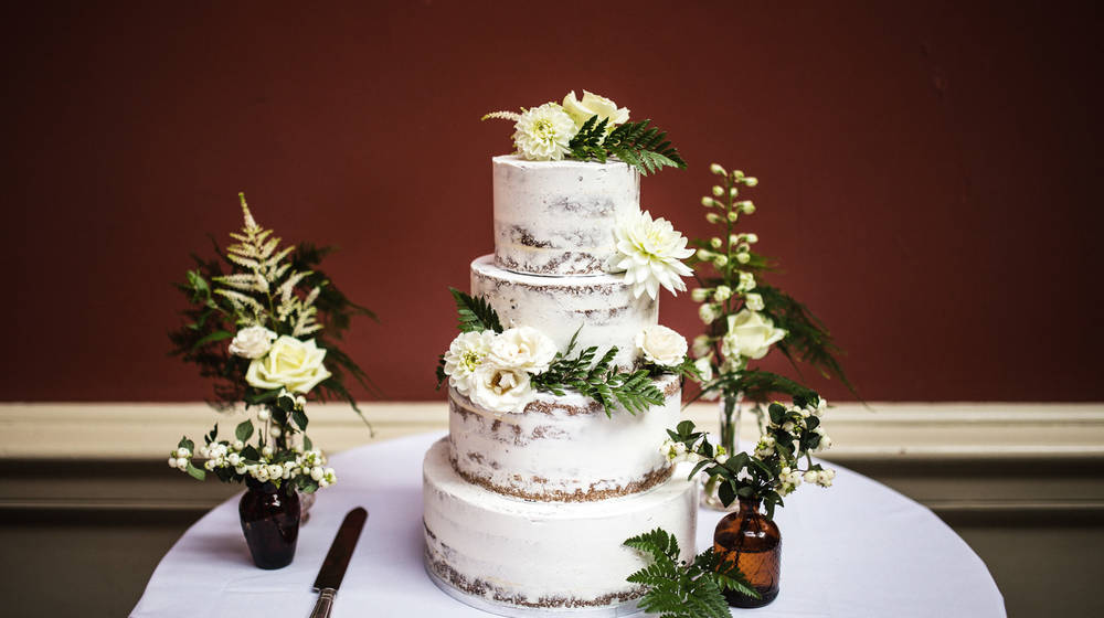 Wedding Cake surrounded by white flowers